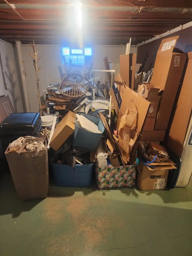 Roll-off dumpster container at job site for 2 Yard Dumpster Rental in Angleton